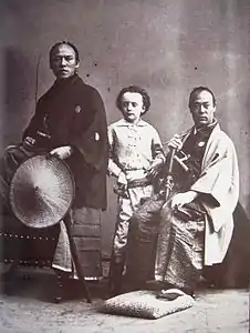 Nadar's son (center) with Yatsu Kanshiro (left) and an unnamed samurai (right), photographed by Nadar. They were members of the Second Japanese Embassy to Europe in 1863