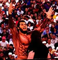 González in a body suit.