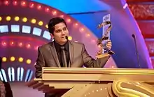 Kamāl Khan at Zee Cine Awards 2012, receiving "Fresh Singing Talent" 2012 Award.