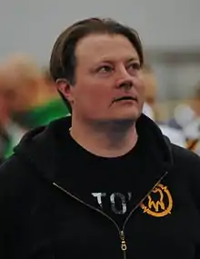 Kari-Jukka  Hietalahti wearing black hoodie, looking up and left of camera