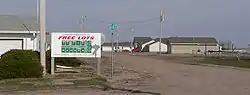 Sign promoting Kenesaw Homestead Act at subdivision entrance