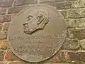 Plaque in the garden showing Trevor Bowen, director of Barkers of Kensington