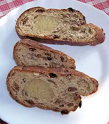 Slices of kerststol showing the almond paste in the middle.
