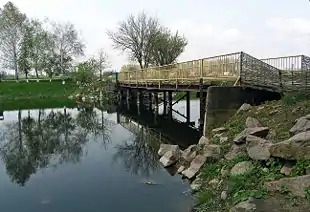 Image 7A wooden bridge leads to the entrance to the Khomutovska Steppe in Donetsk Oblast.