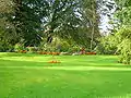 Lawns and flowerbeds at the driveway entrance.