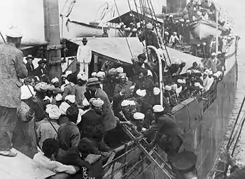 Punjabi Sikhs aboard the SS&nbsp;Komagata Maru in Vancouver's Burrard Inlet, 1914. Most of the passengers were not allowed to land in Canada and the ship was forced to return to India. The events surrounding the Komagata Maru incident served as a catalyst for the Ghadarite cause.