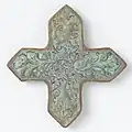 Tile in the shape of a cross with scrolls and birds c. 1250 - c. 1299. The Rijksmuseum