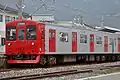 JR Kyushu 103–1500 series in revised livery, April 2006
