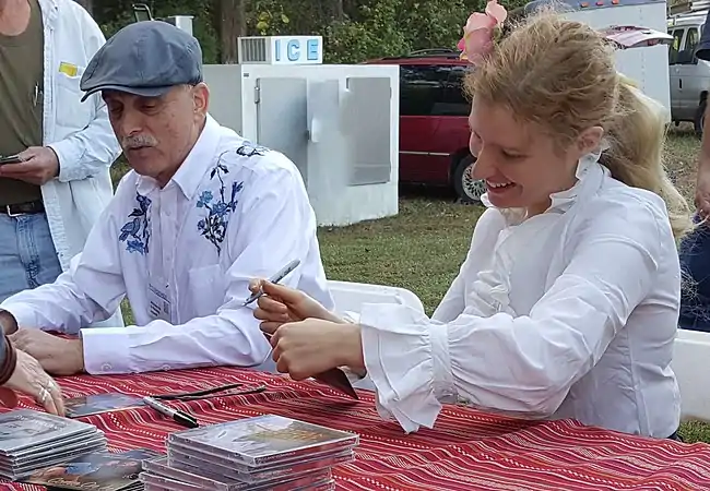 Axelrod and Jim Kweskin autograph CDs at the Kentuck Festival (2015).