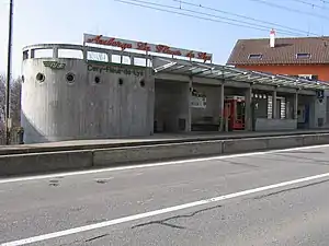 Concrete building with rounded side and flat roof
