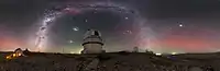 Hues of red and green lighting up the sky are produced by airglow.