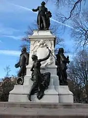 South face, with female statue representing America, and inscription