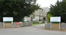 Photograph showing the main entrance of Langham Oaks School with the main school building set in the background
