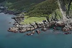 The navigational light at the southwestern tip of Elizabeth Island demarcates the boundary between Cook Inlet and the Gulf of Alaska