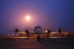 Man directing a plane on a runway