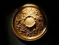 Bronze mirror, with Chinese character of "Longevity" and dragons and clouds decoration. Capital Museum, Beijing, China