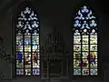 Glass windows in the northern side aisle, originally from the cloisters of Marienfeld Abbey.