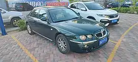 Front three-quarter view of a front-engined four-door car.