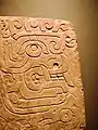 Chavín stela depicting a brindle face. National Museum Chavín de Huántar.