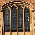 Tudor-style hood mould ending in decorative label stops, Magdalene College, Cambridge