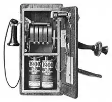 Image 121917 wall telephone, open to show magneto and local battery (from History of the telephone)