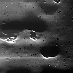 Mansur crater has hollows.  Mansur has the type morphology of a Mansurian crater.