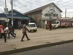 Manzese buildings and shops near the Tip Top rapid bus station, June 2019.
