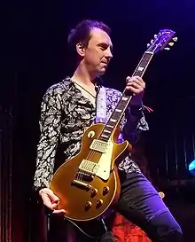 Mark Abrahams on stage with Wishbone Ash