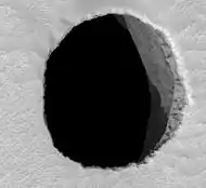 HiRISE closeup of Jeanne showing afternoon illumination of the east wall of the shaft.