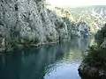 Rock walls towering above the water