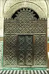 Wooden mashrabiya screen at the entrance of the courtyard