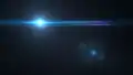 Lens flare commonly associated with the use of anamorphic lenses which are often used in the production of films.