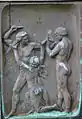 Relief (right) on the socket of the sculpture in Vänersborg