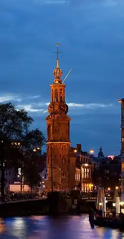 Image 10MunttorenPhoto: Massimo CatarinellaThe Munttoren, a tower in Amsterdam, the Netherlands, as seen from the river Amstel at dusk. The tower was originally part of the Regulierspoort, one of the main gates in Amsterdam's medieval city wall, dating to 1487. After a fire destroyed the gate in 1618, the tower was rebuilt in the Amsterdam Renaissance style, with an eight-sided top half and open spire designed by Hendrick de Keyser, featuring a clock with four faces and a carillon of bells. The name ("Mint Tower") refers to the time when it was temporarily used to mint coins in the Rampjaar ("disastrous year") of 1672 when both England and France declared war on the Dutch Republic, and silver and gold could not be safely transported to Dordrecht and Enkhuizen, where coins were normally minted.More selected pictures