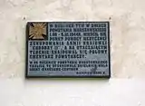 Plaque commemorating the building's importance during the Warsaw Uprising