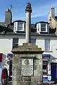 The cross at Musselburgh, East Lothian, topped by the burgh arms