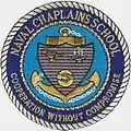 Patch showing US Naval Chaplains School Seal, with "universal" symbols of wisdom and cooperation