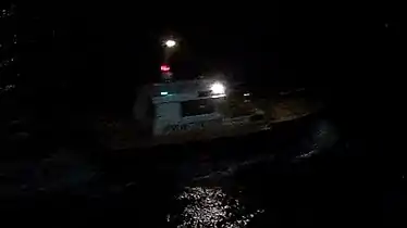Pilot boat in Almeria, Spain, showing the white-over-red night lighting