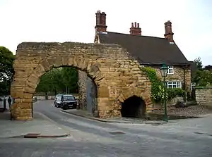 The postern of Newport Arch, built by the ancient Romans in Lincoln, England, located to the right of the larger main arch, and used for pedestrian traffic
