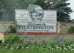 The welcome sign located on Hill Road