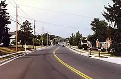 Old Harford Road near Lakewood Road, Carney, Baltimore County, MD, looking north toward intersection with Joppa Road, showing individual ranch-style homes built c.1955