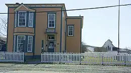 The O'Reilly House with St. Luke's Heritage Centre in the background.