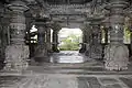 Ornate mantapa (hall) and lathe turned  pillars with decorative base containing relief