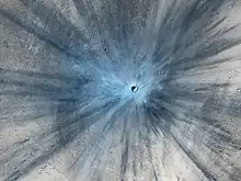 Fresh impact crater on Mars .mw-parser-output .geo-default,.mw-parser-output .geo-dms,.mw-parser-output .geo-dec{display:inline}.mw-parser-output .geo-nondefault,.mw-parser-output .geo-multi-punct{display:none}.mw-parser-output .longitude,.mw-parser-output .latitude{white-space:nowrap}3°42′N 53°24′E﻿ / ﻿3.7°N 53.4°E﻿ / 3.7; 53.4 (November 19, 2013).