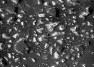 Deep-basin deposits from the floor of Eridania Sea. The mesas on the floor are there because they were protected against intense erosion by deep water/ice cover. CRISM measurements show minerals may be from seafloor hydrothermal deposits.