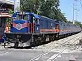 921 wearing the MRail Blue livery hauling 203 series coaches near Santa Mesa station.