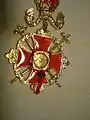 Backside: relic in shape of a rock from Calvary, including the seal of the Patriarch.