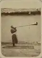 man playing a karnay trumpet