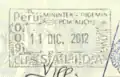 Peruvian exit stamp in a New Zealand passport, issued at Lima Airport. Part of a UK entry stamp is visible in the bottom part, as is part of a Chilean stamp in the right.