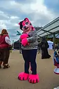 A pink tiger with a fish.